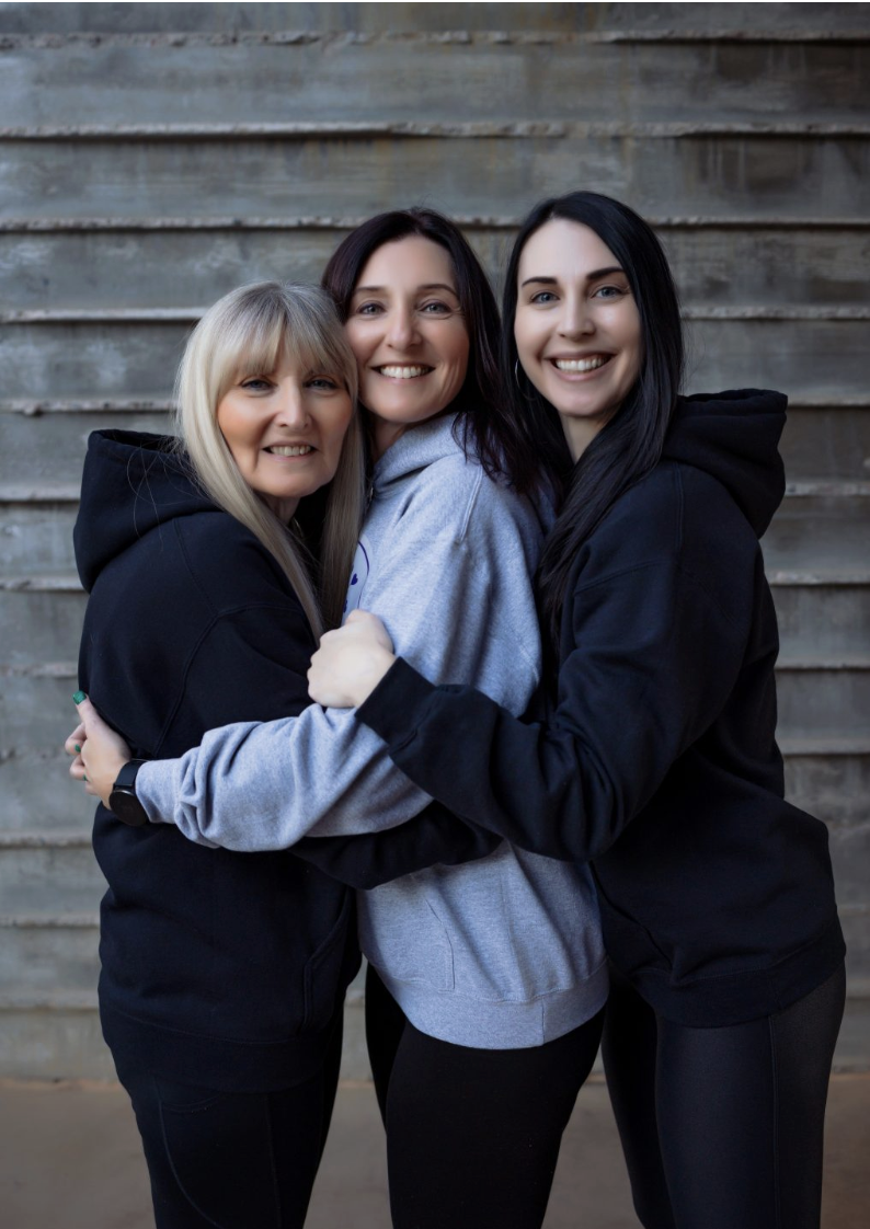 Nicole Pavlik with her team, smiling together